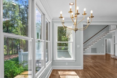 Enjoy sweeping lake views and an exceptional location just steps on Great Waters Course At Reynolds Plantation in Georgia - for sale on GolfHomes.com, golf home, golf lot