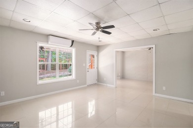 Stunning stucco home in the highly sought-after Summer Grove on Summergrove Golf Club in Georgia - for sale on GolfHomes.com, golf home, golf lot