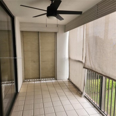 This spacious 2-bedroom condo features laminate wood flooring on Inverrary Country Club in Florida - for sale on GolfHomes.com, golf home, golf lot