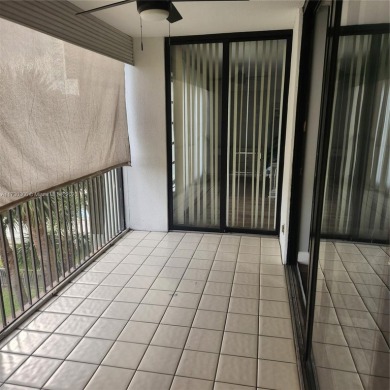 This spacious 2-bedroom condo features laminate wood flooring on Inverrary Country Club in Florida - for sale on GolfHomes.com, golf home, golf lot