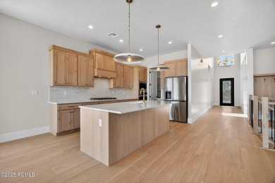 Experience breathtaking views of the city, mountains, and golf on Coral Canyon Golf Course in Utah - for sale on GolfHomes.com, golf home, golf lot