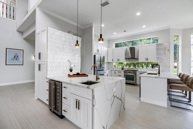 This stunning, renovated estate home is ideally situated within on  in Florida - for sale on GolfHomes.com, golf home, golf lot