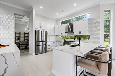 This stunning, renovated estate home is ideally situated within on  in Florida - for sale on GolfHomes.com, golf home, golf lot