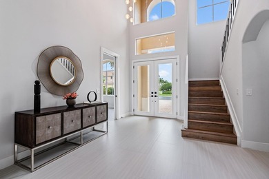 This stunning, renovated estate home is ideally situated within on  in Florida - for sale on GolfHomes.com, golf home, golf lot