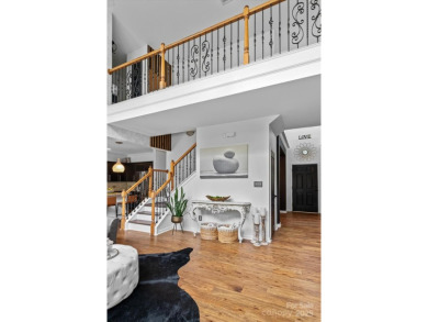 This spacious home offers versatile living,modern updates,and on Highland Creek Golf Club in North Carolina - for sale on GolfHomes.com, golf home, golf lot