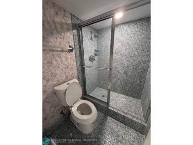 Enjoy breathtaking views of the golf course from your screened on Palm-Aire Country Club and Resort - The Oaks in Florida - for sale on GolfHomes.com, golf home, golf lot