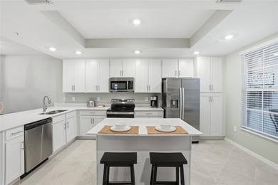 Wake up to shimmering water views and end every day with on Heritage Landing Golf  in Florida - for sale on GolfHomes.com, golf home, golf lot