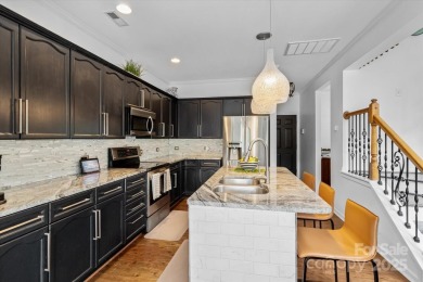 This spacious home offers versatile living,modern updates,and on Highland Creek Golf Club in North Carolina - for sale on GolfHomes.com, golf home, golf lot