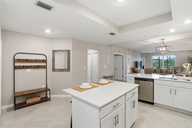 Wake up to shimmering water views and end every day with on Heritage Landing Golf  in Florida - for sale on GolfHomes.com, golf home, golf lot