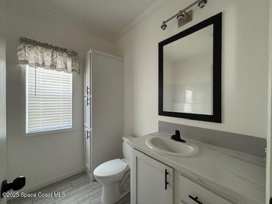 Experience modern Florida living in this stunning new on Barefoot Bay Golf Course in Florida - for sale on GolfHomes.com, golf home, golf lot