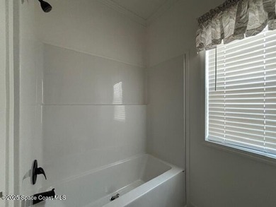 Experience modern Florida living in this stunning new on Barefoot Bay Golf Course in Florida - for sale on GolfHomes.com, golf home, golf lot