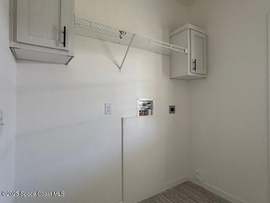 Experience modern Florida living in this stunning new on Barefoot Bay Golf Course in Florida - for sale on GolfHomes.com, golf home, golf lot