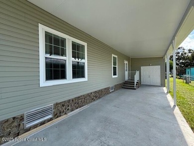 Experience modern Florida living in this stunning new on Barefoot Bay Golf Course in Florida - for sale on GolfHomes.com, golf home, golf lot