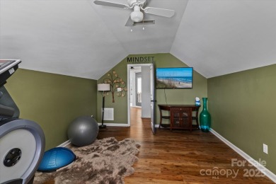 This spacious home offers versatile living,modern updates,and on Highland Creek Golf Club in North Carolina - for sale on GolfHomes.com, golf home, golf lot
