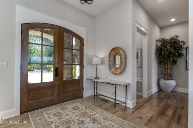 A STORYBOOK HOME ON TELLICO LAKE. 

Tucked into the scenic on Tellico Village -The Links At Kahite Golf Course in Tennessee - for sale on GolfHomes.com, golf home, golf lot