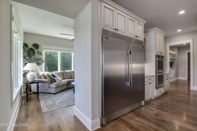 A STORYBOOK HOME ON TELLICO LAKE. 

Tucked into the scenic on Tellico Village -The Links At Kahite Golf Course in Tennessee - for sale on GolfHomes.com, golf home, golf lot