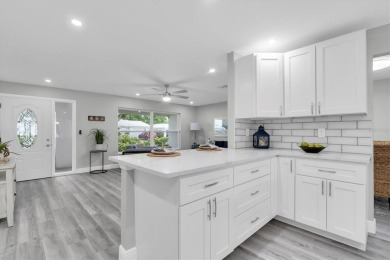 This beautiful renovated block-constructed home is in the 55+ on Mainlands Golf Club in Florida - for sale on GolfHomes.com, golf home, golf lot