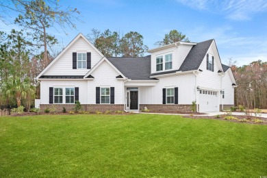Discover the allure of this captivating residence nestled in the on Wild Wing Plantation in South Carolina - for sale on GolfHomes.com, golf home, golf lot
