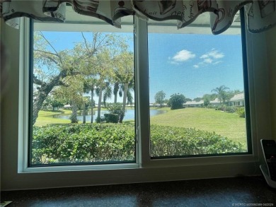 This 2/2 plus den with a 1 car garage is set on a peaceful lake on Martin Downs Country Club in Florida - for sale on GolfHomes.com, golf home, golf lot