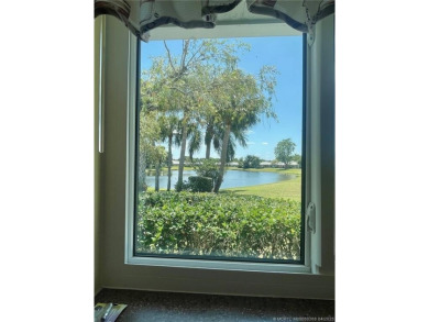 This 2/2 plus den with a 1 car garage is set on a peaceful lake on Martin Downs Country Club in Florida - for sale on GolfHomes.com, golf home, golf lot