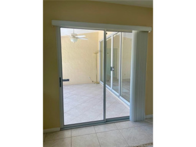 This 2/2 plus den with a 1 car garage is set on a peaceful lake on Martin Downs Country Club in Florida - for sale on GolfHomes.com, golf home, golf lot