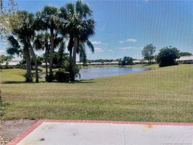 This 2/2 plus den with a 1 car garage is set on a peaceful lake on Martin Downs Country Club in Florida - for sale on GolfHomes.com, golf home, golf lot