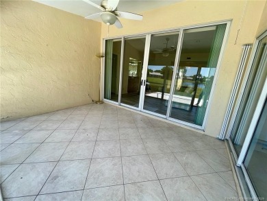 This 2/2 plus den with a 1 car garage is set on a peaceful lake on Martin Downs Country Club in Florida - for sale on GolfHomes.com, golf home, golf lot