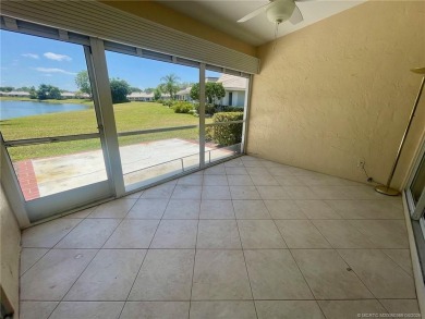 This 2/2 plus den with a 1 car garage is set on a peaceful lake on Martin Downs Country Club in Florida - for sale on GolfHomes.com, golf home, golf lot