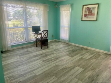 This 2/2 plus den with a 1 car garage is set on a peaceful lake on Martin Downs Country Club in Florida - for sale on GolfHomes.com, golf home, golf lot