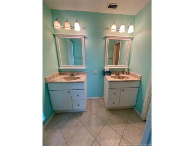 This 2/2 plus den with a 1 car garage is set on a peaceful lake on Martin Downs Country Club in Florida - for sale on GolfHomes.com, golf home, golf lot