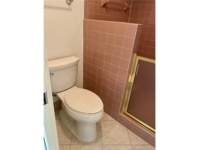 This 2/2 plus den with a 1 car garage is set on a peaceful lake on Martin Downs Country Club in Florida - for sale on GolfHomes.com, golf home, golf lot