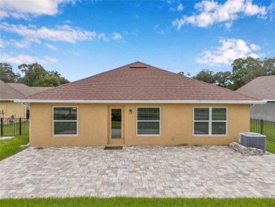 Welcome to this beautifully maintained 3-bedroom, 2-bathroom on Meadow Oaks Golf and Country Club in Florida - for sale on GolfHomes.com, golf home, golf lot