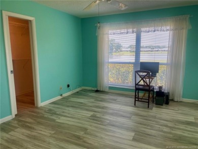 This 2/2 plus den with a 1 car garage is set on a peaceful lake on Martin Downs Country Club in Florida - for sale on GolfHomes.com, golf home, golf lot