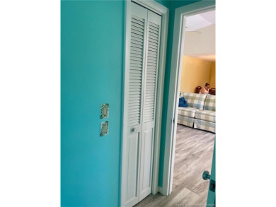 This 2/2 plus den with a 1 car garage is set on a peaceful lake on Martin Downs Country Club in Florida - for sale on GolfHomes.com, golf home, golf lot
