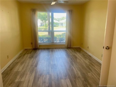 This 2/2 plus den with a 1 car garage is set on a peaceful lake on Martin Downs Country Club in Florida - for sale on GolfHomes.com, golf home, golf lot