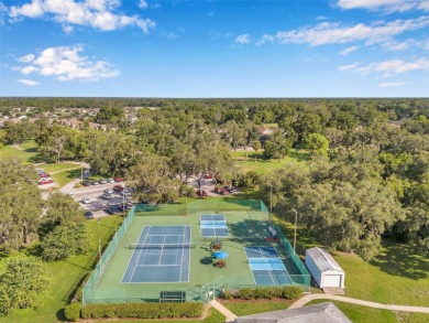 Welcome to this beautifully maintained 3-bedroom, 2-bathroom on Meadow Oaks Golf and Country Club in Florida - for sale on GolfHomes.com, golf home, golf lot