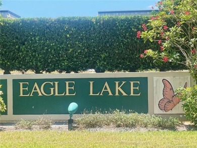 This 2/2 plus den with a 1 car garage is set on a peaceful lake on Martin Downs Country Club in Florida - for sale on GolfHomes.com, golf home, golf lot