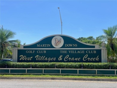 This 2/2 plus den with a 1 car garage is set on a peaceful lake on Martin Downs Country Club in Florida - for sale on GolfHomes.com, golf home, golf lot