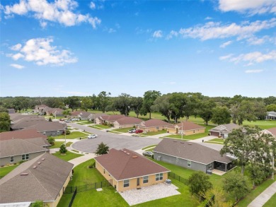 Welcome to this beautifully maintained 3-bedroom, 2-bathroom on Meadow Oaks Golf and Country Club in Florida - for sale on GolfHomes.com, golf home, golf lot