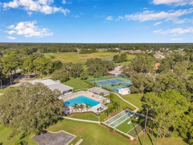 Welcome to this beautifully maintained 3-bedroom, 2-bathroom on Meadow Oaks Golf and Country Club in Florida - for sale on GolfHomes.com, golf home, golf lot