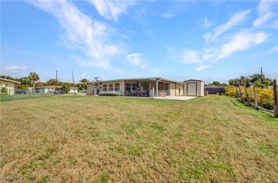 CHARMING MID-CENTURY HOME IN A QUIET CUL-DE-SAC WITH WATER VIEWS on Port Charlotte Golf Club in Florida - for sale on GolfHomes.com, golf home, golf lot