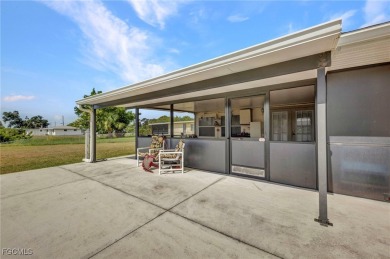 CHARMING MID-CENTURY HOME IN A QUIET CUL-DE-SAC WITH WATER VIEWS on Port Charlotte Golf Club in Florida - for sale on GolfHomes.com, golf home, golf lot