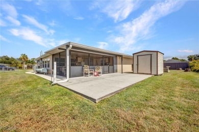 CHARMING MID-CENTURY HOME IN A QUIET CUL-DE-SAC WITH WATER VIEWS on Port Charlotte Golf Club in Florida - for sale on GolfHomes.com, golf home, golf lot
