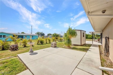 CHARMING MID-CENTURY HOME IN A QUIET CUL-DE-SAC WITH WATER VIEWS on Port Charlotte Golf Club in Florida - for sale on GolfHomes.com, golf home, golf lot