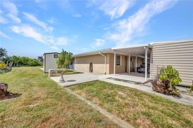 CHARMING MID-CENTURY HOME IN A QUIET CUL-DE-SAC WITH WATER VIEWS on Port Charlotte Golf Club in Florida - for sale on GolfHomes.com, golf home, golf lot