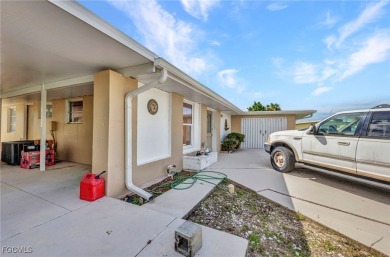 CHARMING MID-CENTURY HOME IN A QUIET CUL-DE-SAC WITH WATER VIEWS on Port Charlotte Golf Club in Florida - for sale on GolfHomes.com, golf home, golf lot