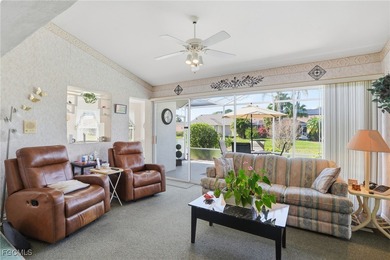 From the moment you step inside, cathedral ceilings fill the on Sabal Springs Golf and Racquet Club in Florida - for sale on GolfHomes.com, golf home, golf lot
