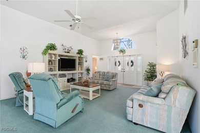 From the moment you step inside, cathedral ceilings fill the on Sabal Springs Golf and Racquet Club in Florida - for sale on GolfHomes.com, golf home, golf lot