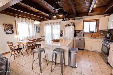 Welcome to this spacious and light-filled contemporary retreat on The Hideout Golf in Pennsylvania - for sale on GolfHomes.com, golf home, golf lot