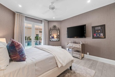 Experience luxury living in this beautifully renovated courtyard on Polo Club of Boca Raton in Florida - for sale on GolfHomes.com, golf home, golf lot